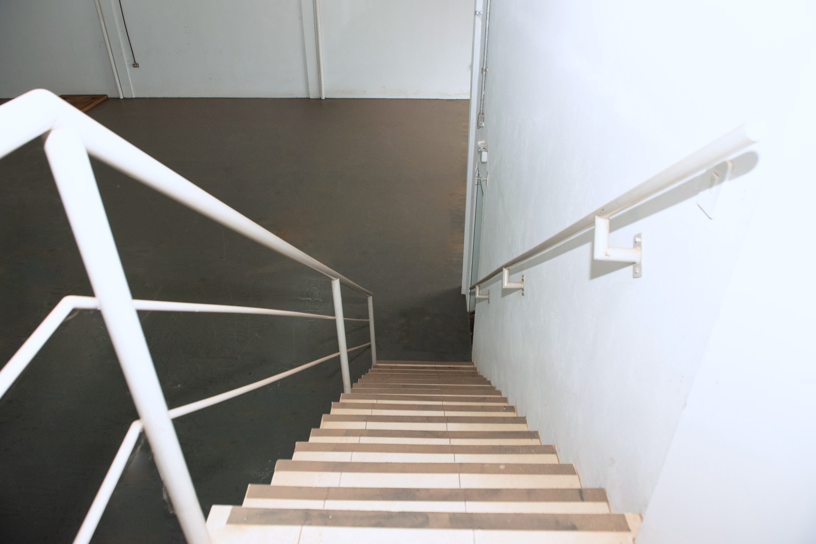 Internal staircase with a guardrail in Warehouse 10